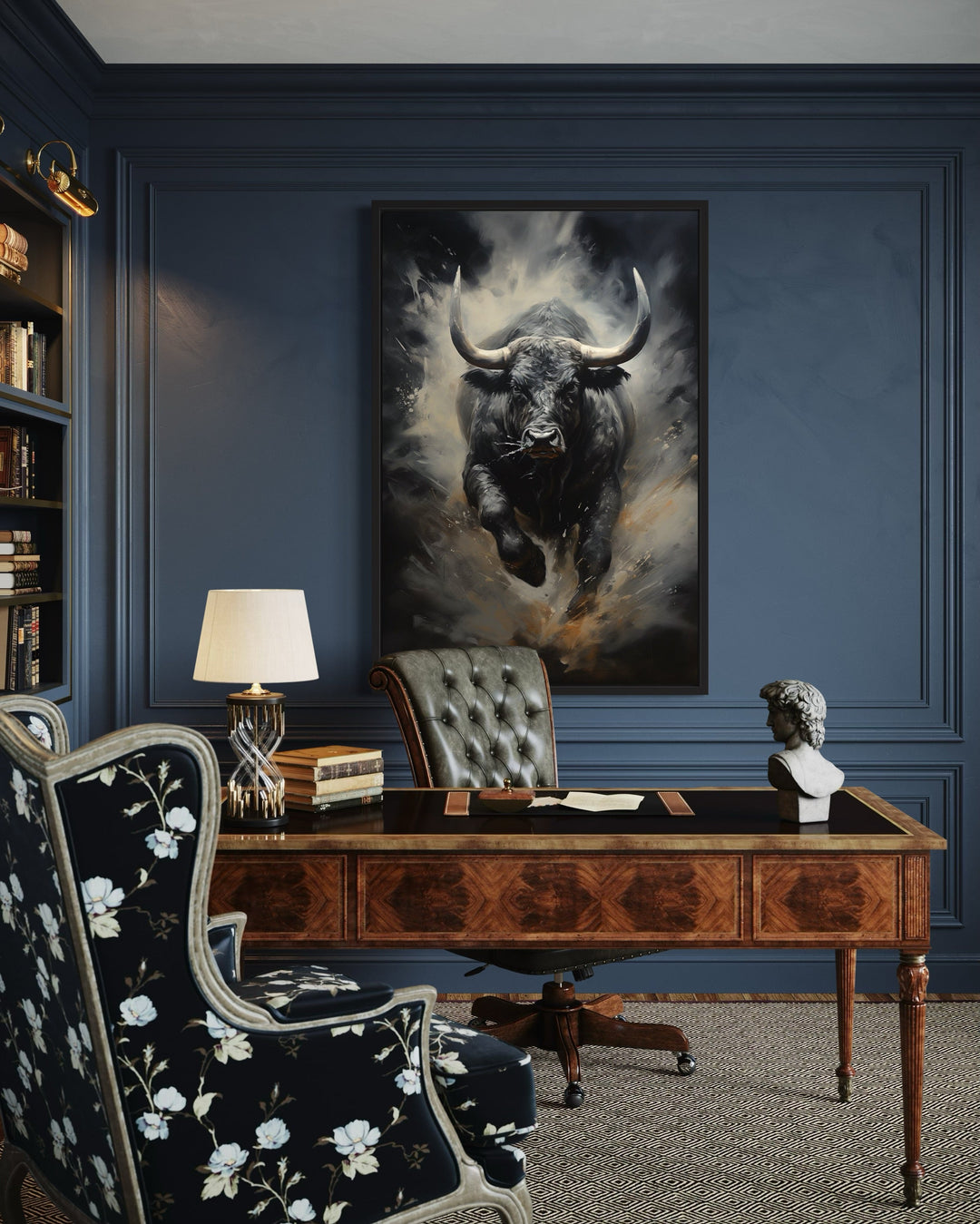 Black charging bull abstract framed canvas wall art hanging in a dark blue office above a desk.