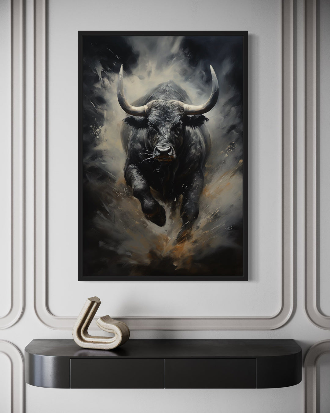 Black charging bull abstract framed canvas wall art hanging above a black console table.