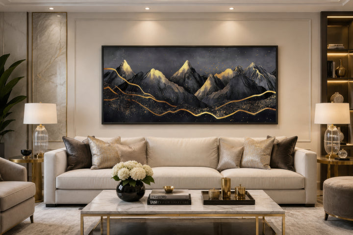 Black Gold Abstract Mountain Framed Canvas Wall Art hanging above a sofa in a modern living room.