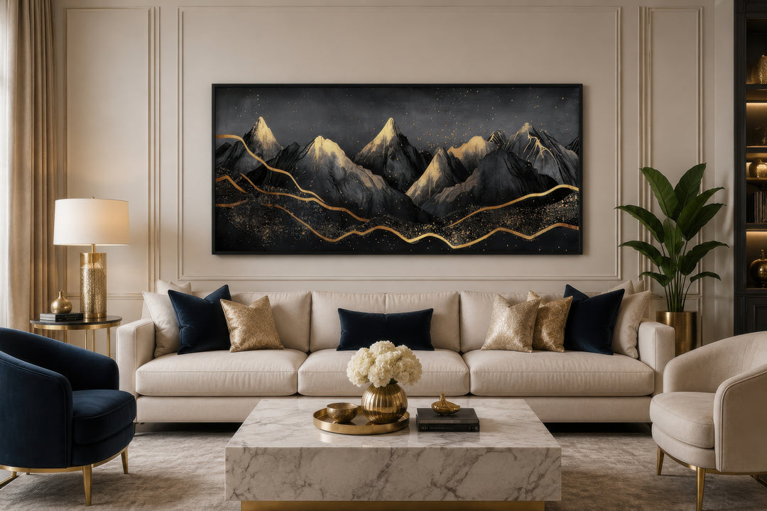 Black Gold Abstract Mountain Framed Canvas Wall Art hanging above a cream sofa in a living room.
