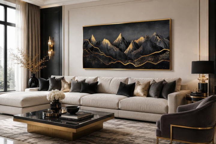Black Gold Abstract Mountain Framed Canvas Wall Art hanging above a modern sofa in a living room.