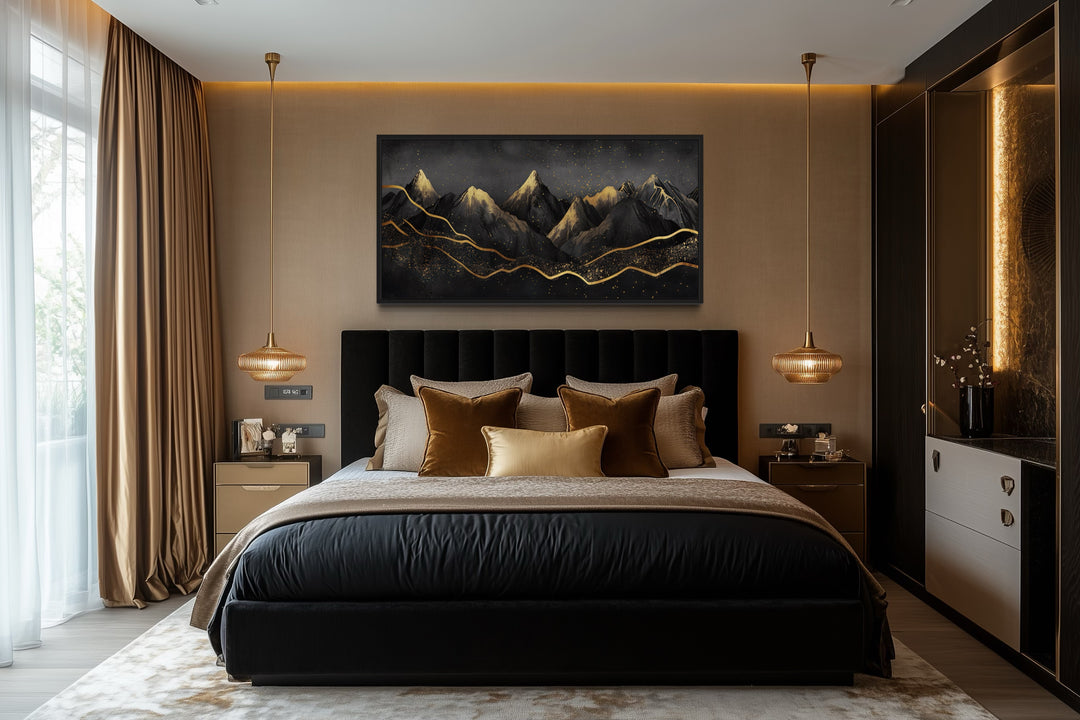 Black and gold abstract mountain framed canvas wall art hanging above a bed in a modern bedroom.