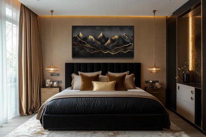 Black and gold abstract mountain framed canvas wall art hanging above a bed in a modern bedroom.