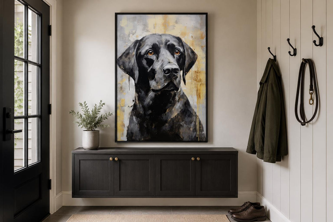 Black Lab Abstract Portrait Canvas Wall Art in a black frame hanging above a dark entryway console.