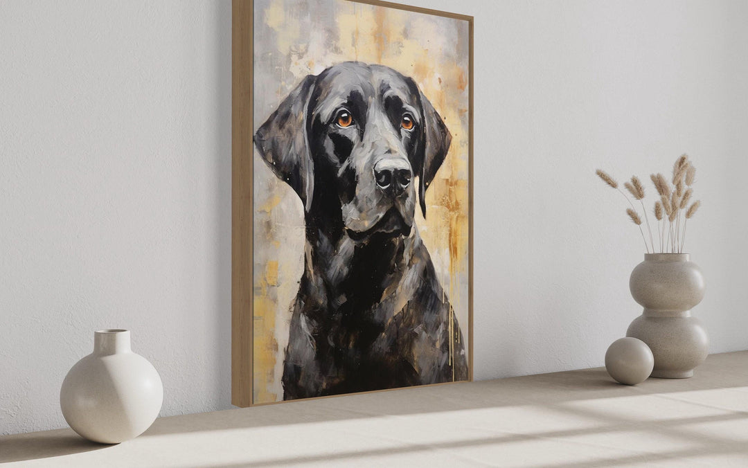 Black Lab Abstract Portrait Canvas Wall Art in a slim wood frame on a neutral wall.