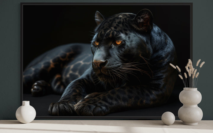 Framed canvas wall art of a black panther on a black background.