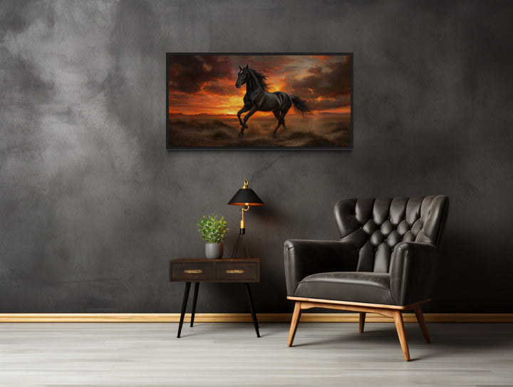 Black Stallion at Sunset Framed Canvas Wall Art in a room with a chair