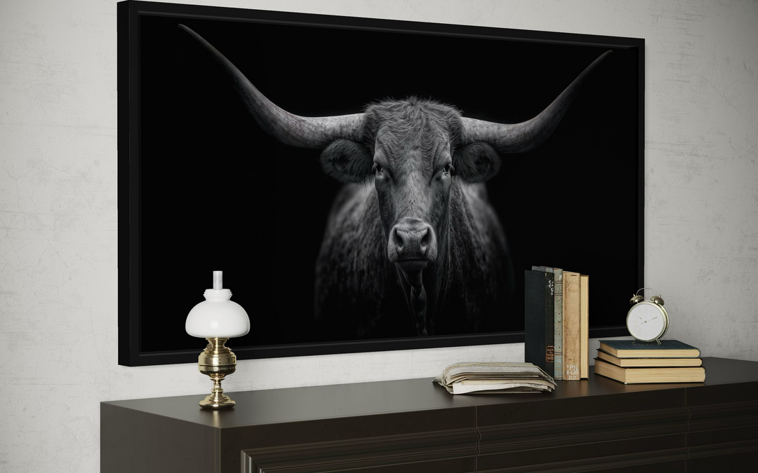 Black Texas Longhorn cow extra large canvas wall art in a black frame above a dark wood dresser.