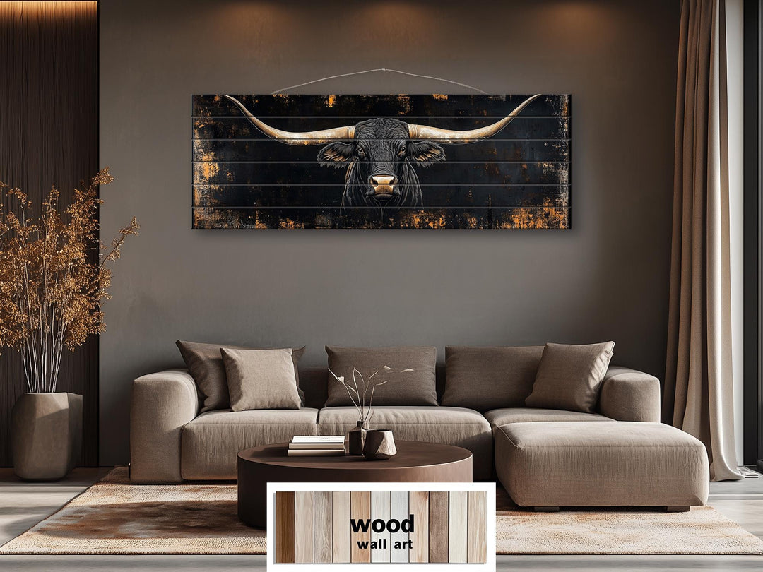 Black Texas Longhorn printed on horizontal rustic wood planks above a modern brown sofa.