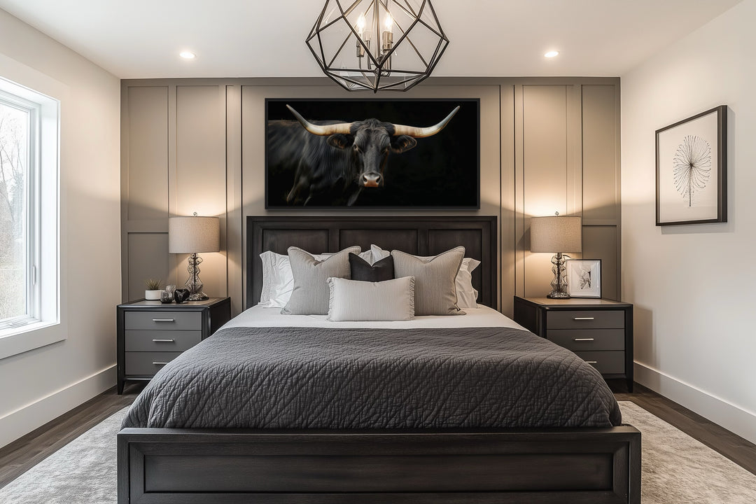 Extra large framed canvas print of a black Texas Longhorn bull above a bed in a modern bedroom.