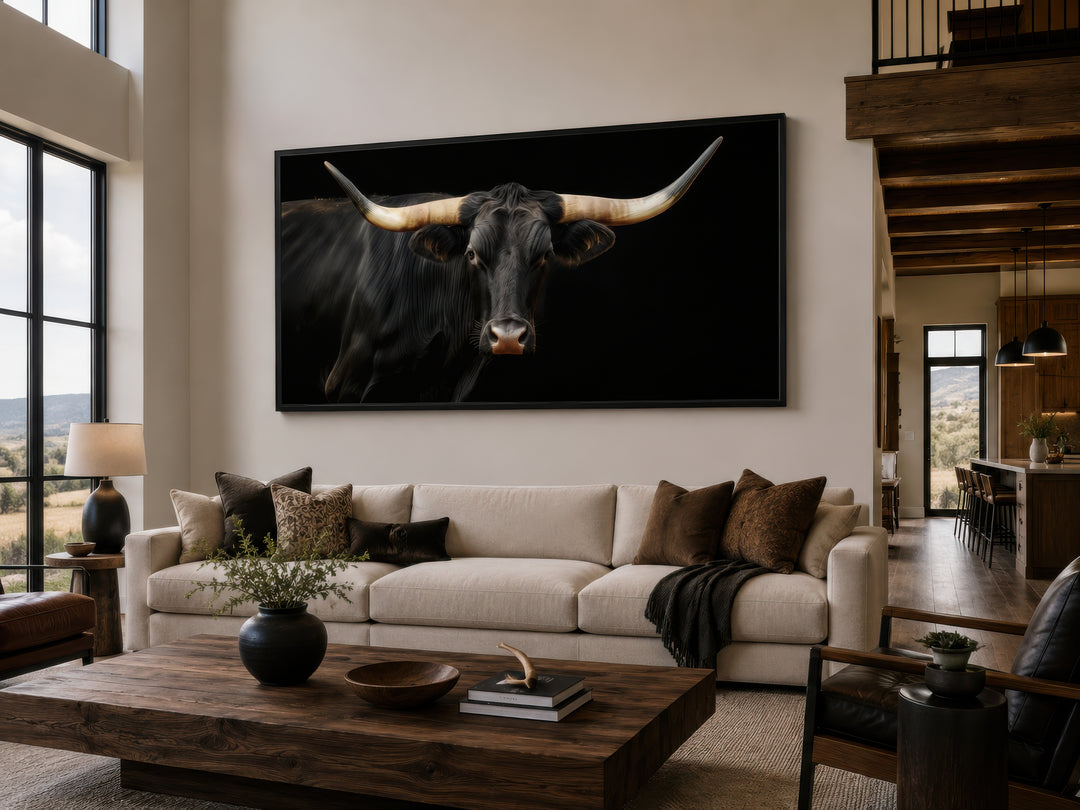 Extra large framed canvas print of a black Texas Longhorn bull in a modern rustic living room.