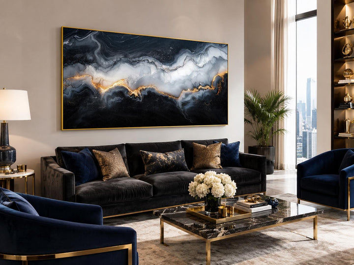Large black, white, and gold abstract marble canvas print above a sofa in a modern living room.