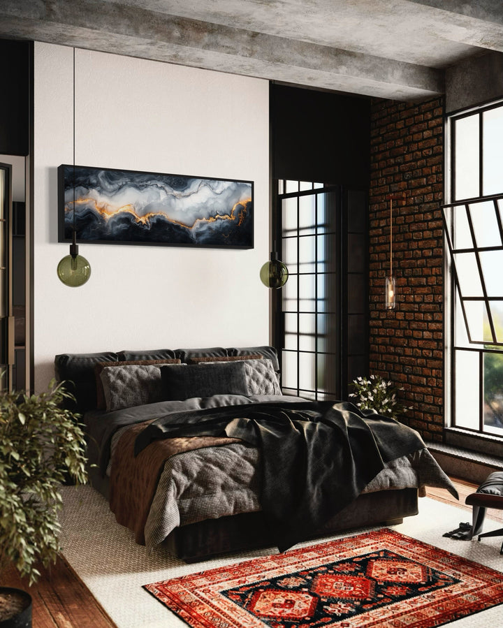 Long horizontal framed canvas wall art featuring a black, white, and gold marble abstract painting.