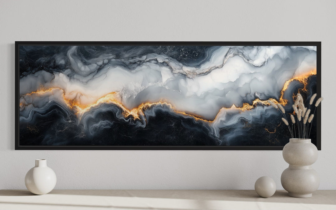 Horizontal framed canvas wall art with black, white, and gold abstract marble pattern.