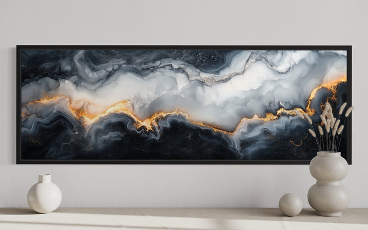 Horizontal framed canvas wall art with black, white, and gold abstract marble pattern.