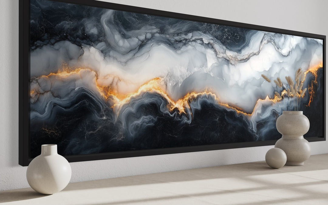 Long horizontal framed canvas wall art with black, white, and gold marble abstract painting.