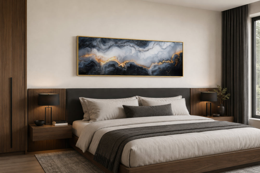 Black, white, and gold marble horizontal framed canvas wall art hanging above a bed.