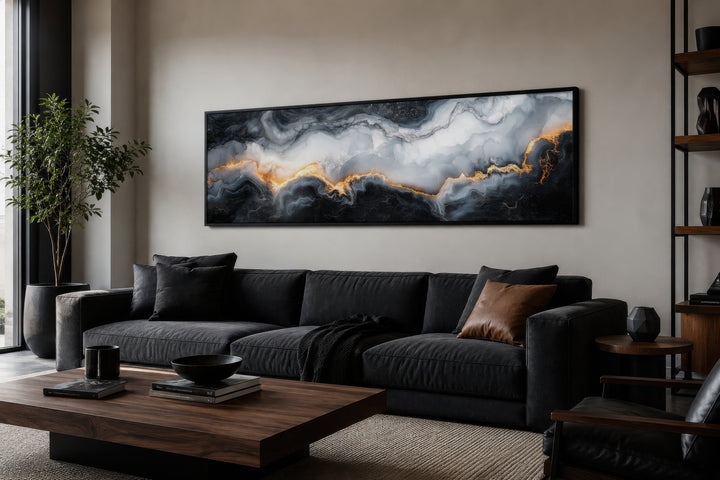 Long horizontal framed canvas wall art with black, white, and gold marble abstract painting.