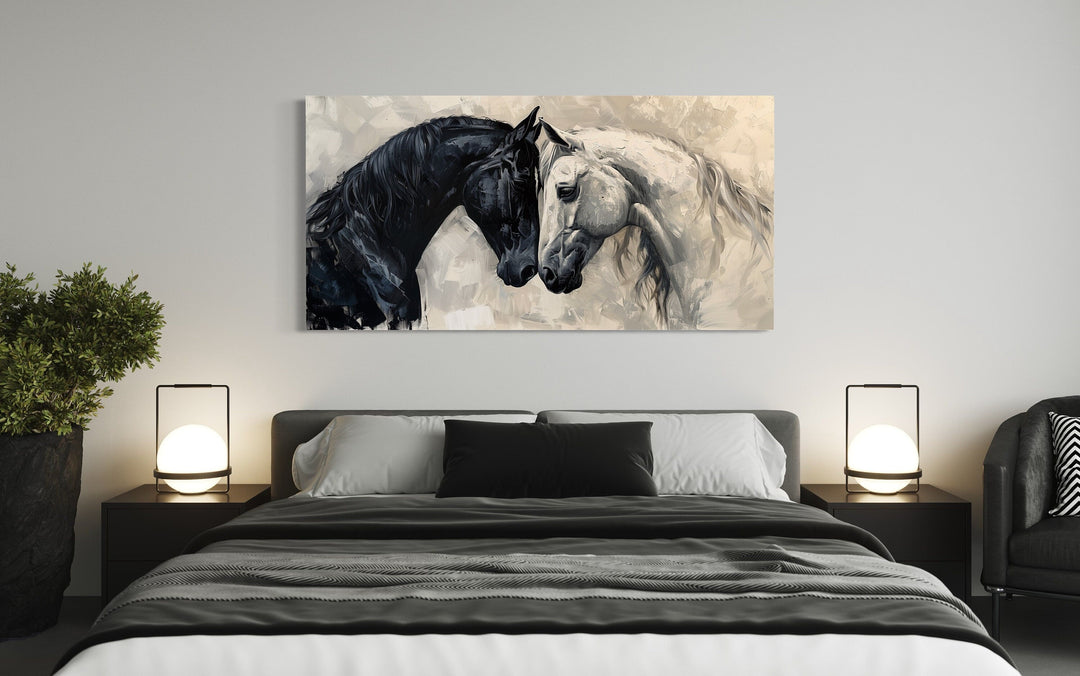 Black and white horses hugging framed canvas wall art above a bed in a modern minimalist bedroom.
