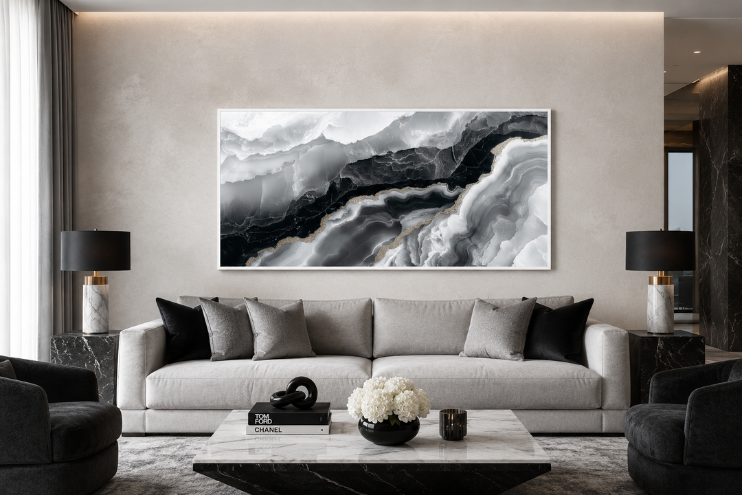 Abstract black and white marble canvas wall art above a modern grey sofa in a living room.