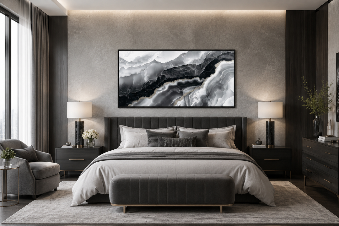 Horizontal abstract black and white marble canvas wall art hanging above a bed in a modern bedroom.