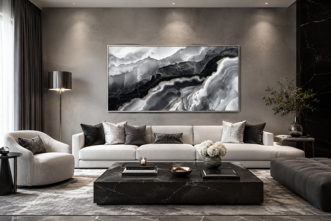 Abstract black and white marble canvas wall art hanging above a white sofa in a modern living room.