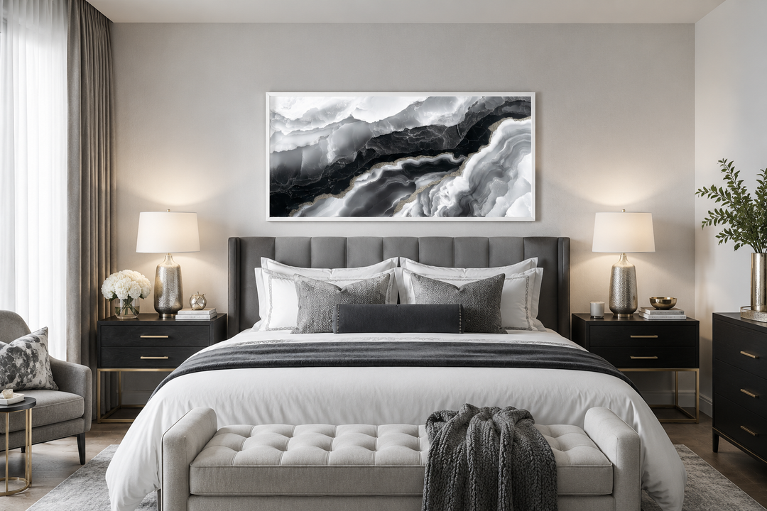 Abstract black and white marble canvas wall art hanging above a bed in a modern bedroom.