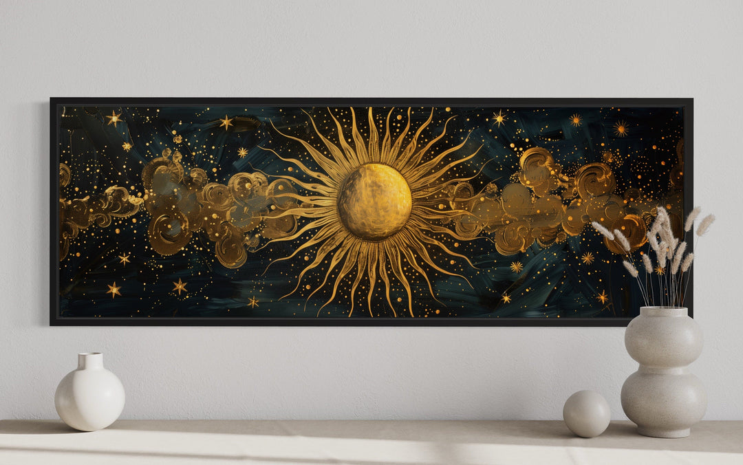Long narrow framed canvas wall art featuring a golden sun and stars on a dark background.