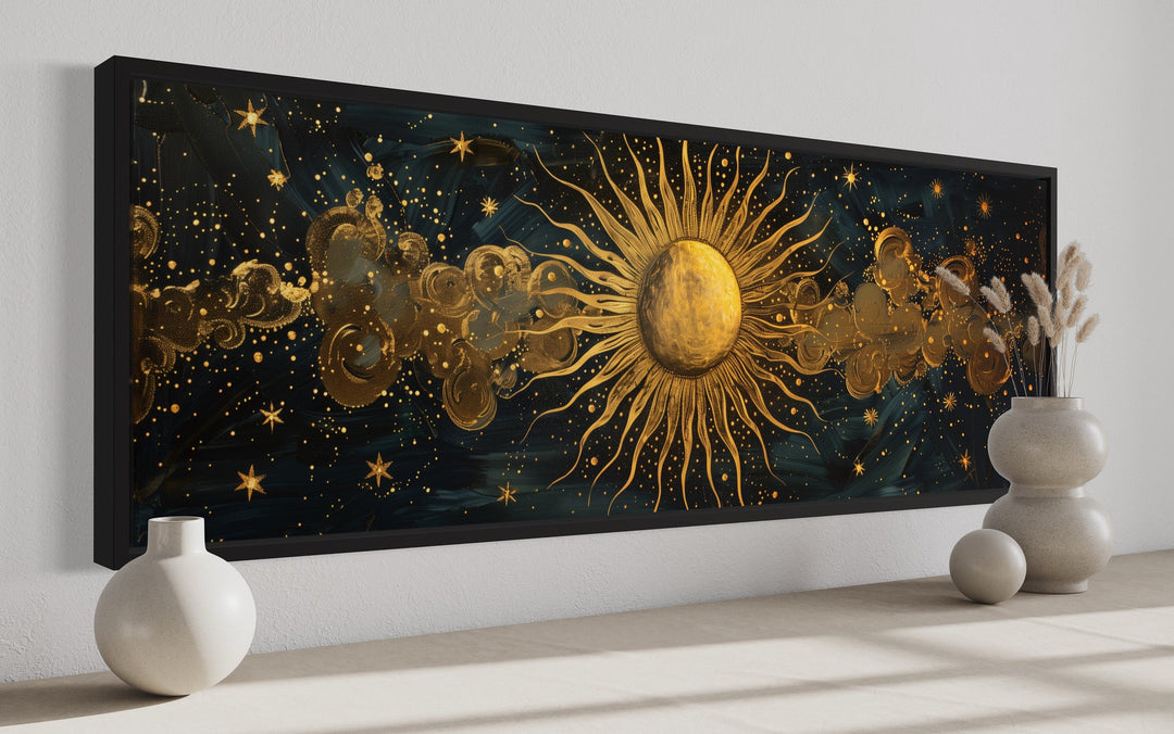 Long narrow framed canvas wall art featuring a golden sun and stars on a dark background.
