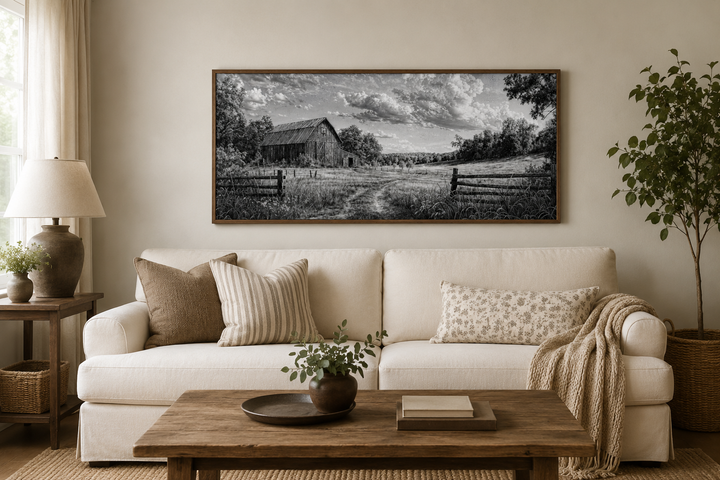 Black and white barn landscape canvas wall art in a rustic farmhouse living room.