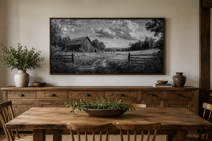Black and white barn landscape canvas wall art in a rustic farmhouse dining room.