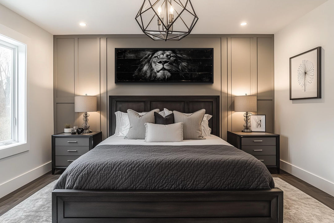 Black and white horizontal canvas wall art of a lion's face hanging above a bed in a modern bedroom.