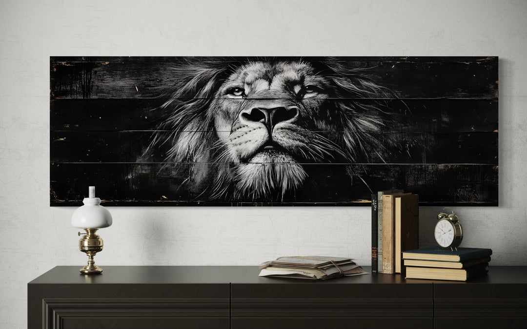 Black and white lion face canvas wall art on a long horizontal wood-textured background.