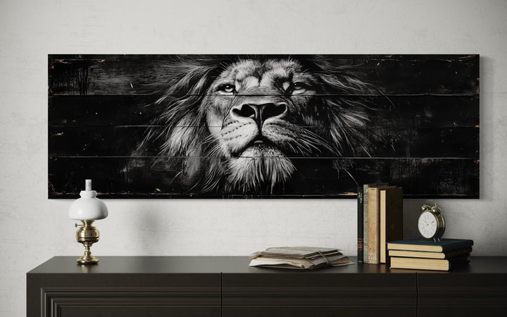 Black and white lion face canvas wall art on a long horizontal wood-textured background.