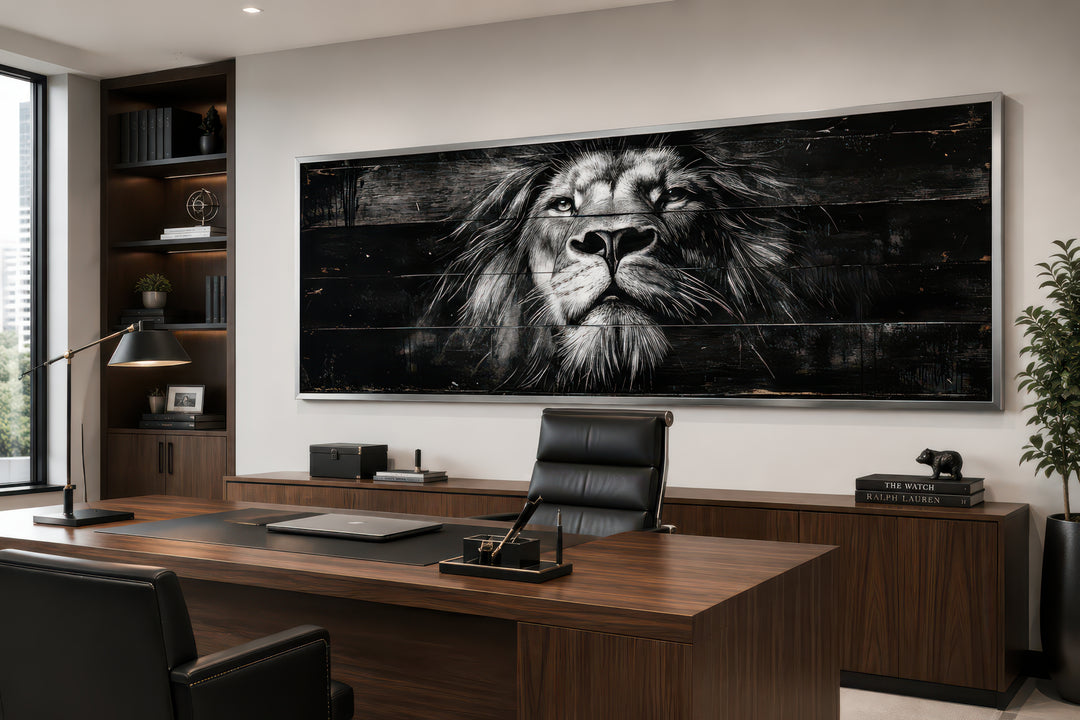 Black and white lion face close-up on a long horizontal canvas wall art in a modern office.