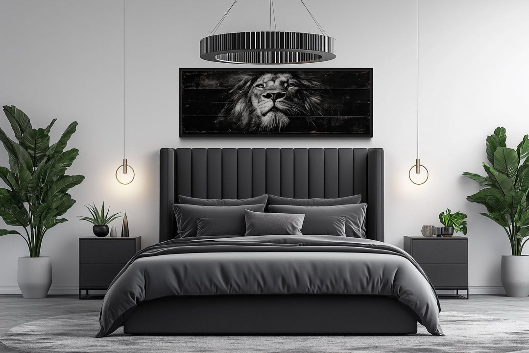 Black and white lion horizontal canvas wall art centered above a modern dark gray bed.