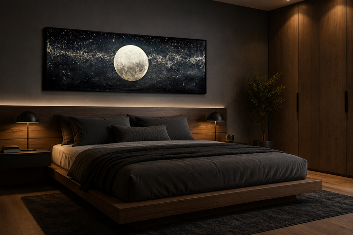 Horizontal black and white canvas print of a full moon in a starry sky above a modern bed.
