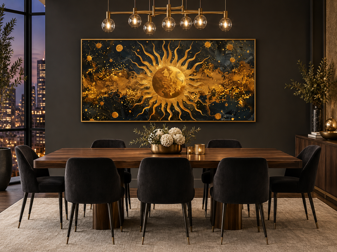 Framed black and gold sun canvas art above a dining table in a modern, dark-toned room.