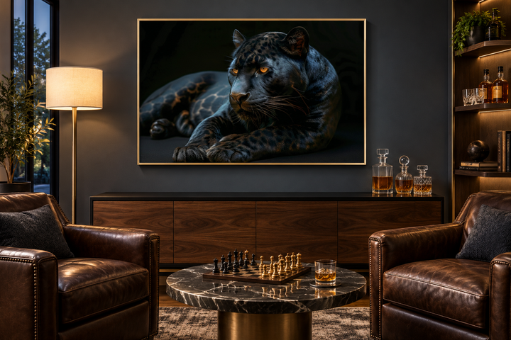 Black panther framed canvas wall art in a gold frame above a wooden sideboard in a modern room.