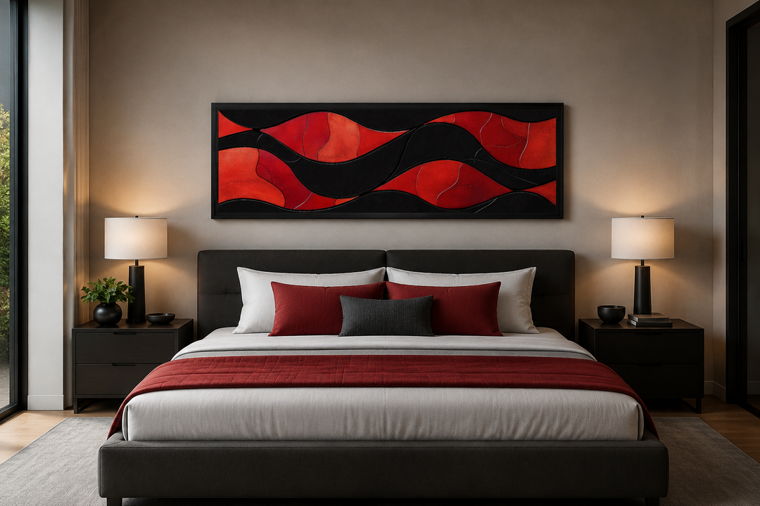 Black and red modern abstract horizontal framed canvas wall art hanging above a bed.