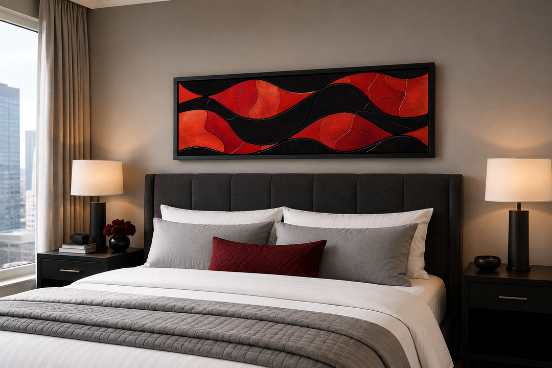 Black and red modern abstract horizontal framed canvas wall art hanging above a bed.