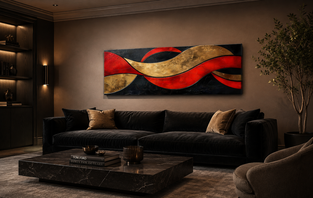Black, red, and gold geometric horizontal abstract wall art above a black sofa in a modern room.