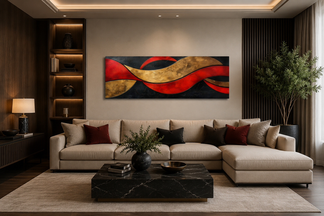 Horizontal abstract wall art with black, red, and gold geometric waves above a beige sectional sofa.