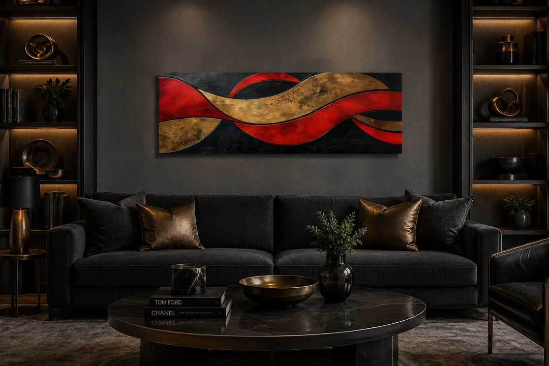 Black, red, and gold geometric abstract horizontal wall art above a dark sofa in a modern room.