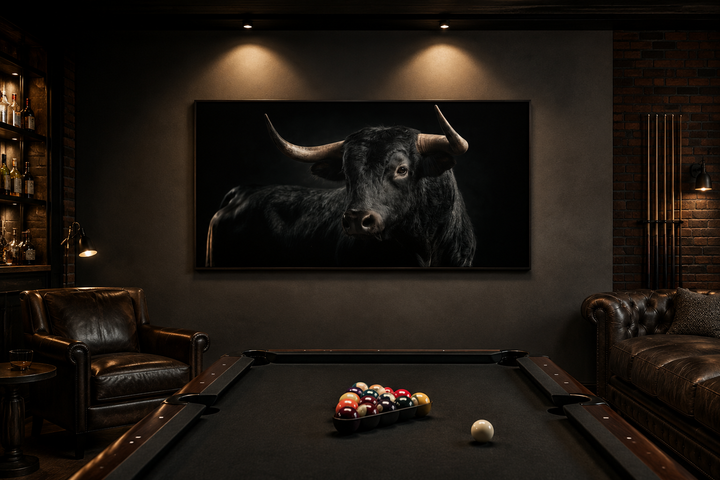 Extra large framed canvas of a black Spanish bull in a masculine office with a pool table.