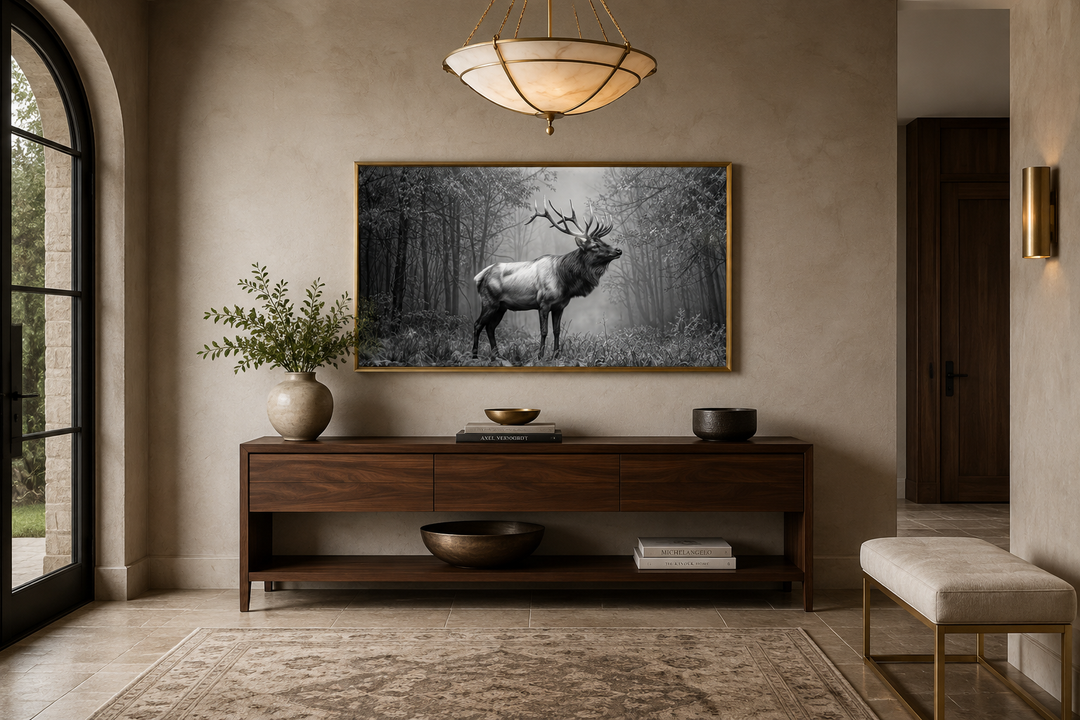 Elk stag in the forest black and white photography framed canvas wall art in a gold frame.