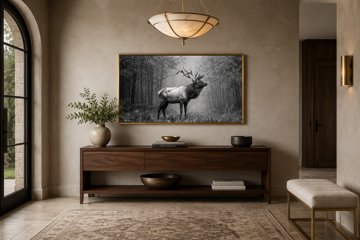 Elk stag in the forest black and white photography framed canvas wall art in a gold frame.