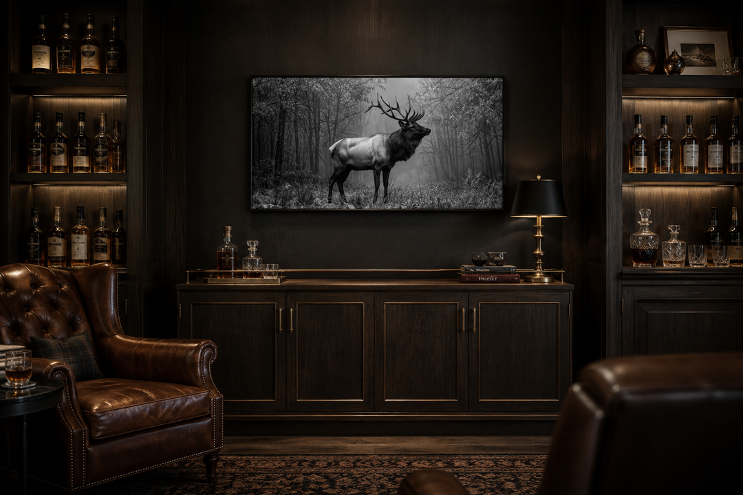 Black and white framed canvas wall art of an elk stag standing in a misty forest.