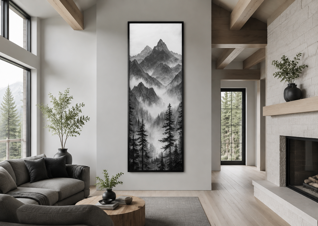 Long vertical black and white canvas wall art of a foggy mountain forest in a modern living room.