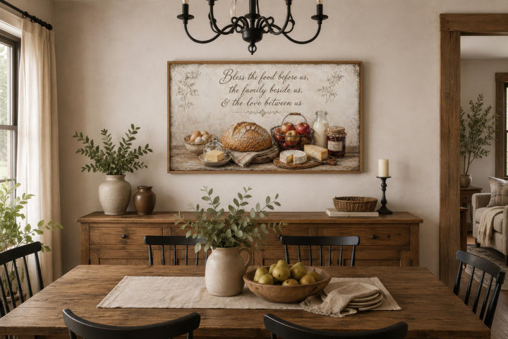 Rustic farmhouse canvas wall art with a food still life and a blessing above a dining room sideboard.